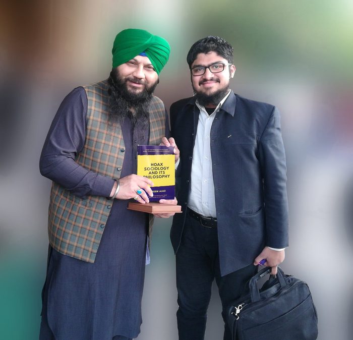 Presenting the book to Mahinder Pall Singh