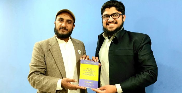 Presenting the book to Mahmood Ahmad Azmi