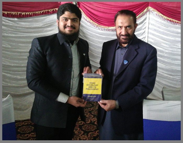 Presenting the book to Mian Muhammad Aslam