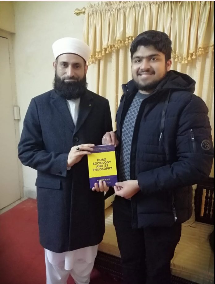 Presenting the book to Pir Mohammad Tayyab Rehman