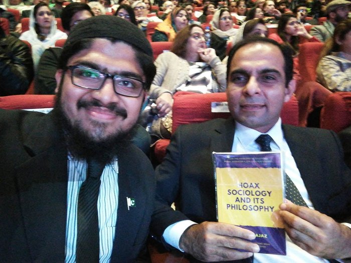 Presenting the book to Qasim Ali Shah