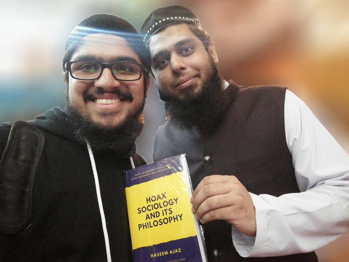 Presenting the book to Muhammad Saad Arslan Sadiq