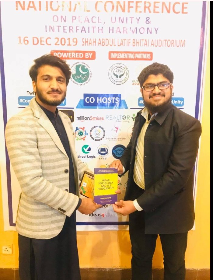 Presenting the book to Shab Niaz Khan