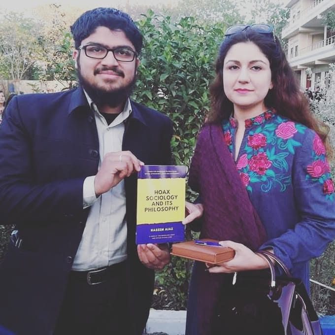 Presenting the book to Zunera Malik